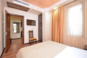 Postel nebo postele na pokoji v ubytování Partez Boutique Hotel