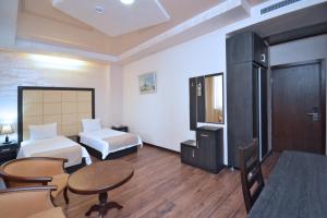 Postel nebo postele na pokoji v ubytování Partez Boutique Hotel
