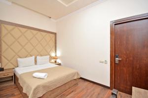 Postel nebo postele na pokoji v ubytování Partez Boutique Hotel