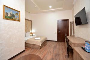 Postel nebo postele na pokoji v ubytování Partez Boutique Hotel