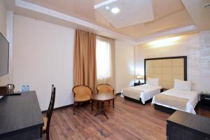 Postel nebo postele na pokoji v ubytování Partez Boutique Hotel
