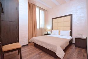 Postel nebo postele na pokoji v ubytování Partez Boutique Hotel
