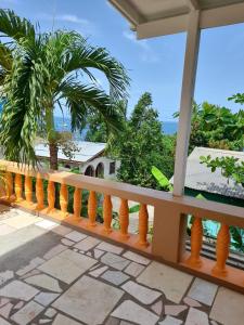 a balcony with a view of the ocean at Faith & Peace Guest House in Fontenoy