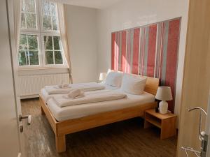 Ein Bett oder Betten in einem Zimmer der Unterkunft "Unnen" in der Alten Schule Greetsiel
