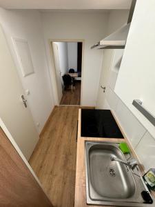 a kitchen with a sink and a counter top at Apartments Haar in Haar +4 photos
