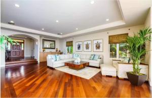 a living room with a couch and a table at Breathtaking Oceanfront Lahaina Villa in Lahaina