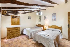 Postel nebo postele na pokoji v ubytování Cortijo La Mata - Casas Rurales Luis + 62 fotografií