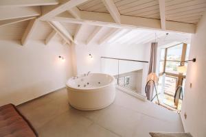 a large white bathroom with a tub in a room at Boho Garden Selimiye in Selimiye +66 photos