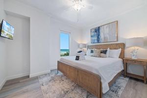 a bedroom with a bed and a desk and a window at Perdido Dunes Tower 2 East in Orange Beach +41 photos