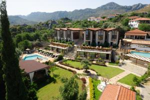 an aerial view of a mansion with a swimming pool at Boho Garden Selimiye in Selimiye