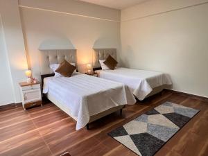 Ένα ή περισσότερα κρεβάτια σε δωμάτιο στο Casa Jardín Tarija