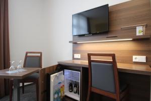 TV a/nebo společenská místnost v ubytování Trip Inn Goethe Conference Hotel