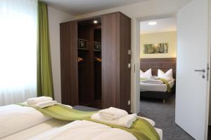 Postel nebo postele na pokoji v ubytování Trip Inn Goethe Conference Hotel