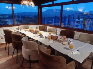 a dining room with a table with food on it at Riad abi khancha in Chefchaouen