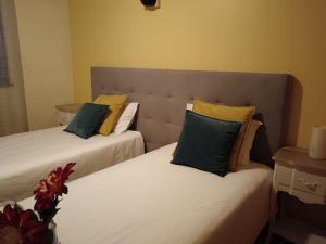 En eller flere senge i et værelse på Casa da Vila