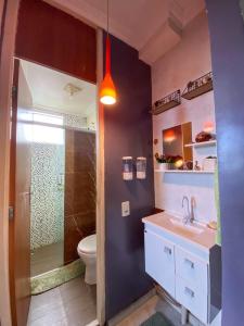 a bathroom with a sink and a toilet at COP30 aluguel in Marituba +19 photos