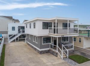 an image of a house with a balcony at Surf Shore Properties in North Wildwood