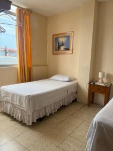 Postel nebo postele na pokoji v ubytování Hotel Mileto