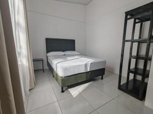 a bedroom with a bed in a room at Casa Celeste Rio Grande #2 in Puntarenas +34 photos