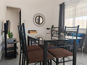 a dining room with a table and chairs at Casa Celeste Rio Grande #2 in Puntarenas