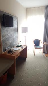 A television and/or entertainment centre at Hotel Friesen