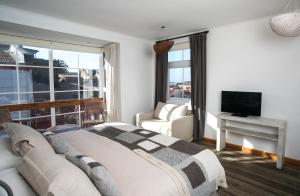 TV a/nebo společenská místnost v ubytování Casa Galos Hotel & Lofts + 37 fotografií