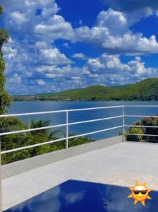 a view of a body of water from a balcony at Casa Bela Vista in Pão de Açúcar