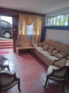 a living room with a couch and a window at Apartamento Cueva del OSO II in San Cristóbal