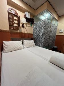 מיטה או מיטות בחדר ב-Venetian Hostel
