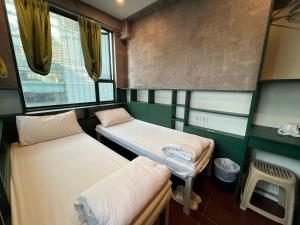 מיטה או מיטות בחדר ב-Venetian Hostel
