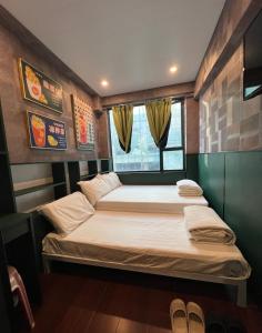 מיטה או מיטות בחדר ב-Venetian Hostel