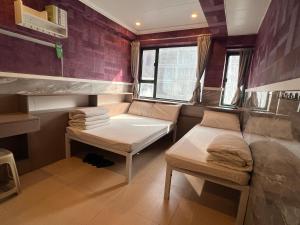 מיטה או מיטות בחדר ב-Venetian Hostel