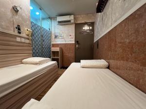 מיטה או מיטות בחדר ב-Venetian Hostel