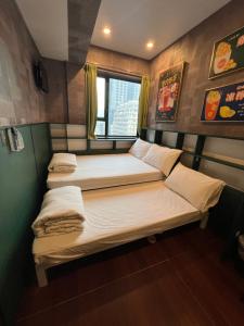 מיטה או מיטות בחדר ב-Venetian Hostel