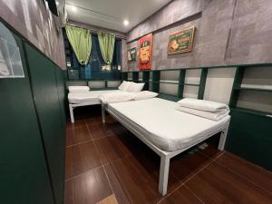 מיטה או מיטות בחדר ב-Venetian Hostel