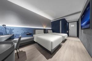 Voodi või voodid majutusasutuse Atour Light Hotel Shenzhen North Railway Station Subway Station toas