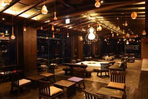 a restaurant with tables and chairs and lights at TAOYA Kawaji in Nikko +19 photos