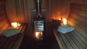 an inside view of a stove in a sauna at Hotel Rubens in De Haan
