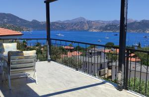 a balcony with a view of the water at DURU selimiye konukevi in Selimiye