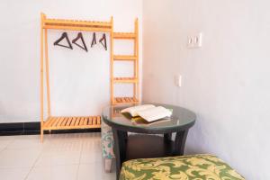 a small table with a book on it in a room at Aurora Holiday House Kintamani in Kintamani