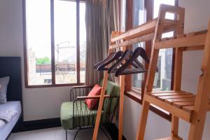 a room with a bunk bed with shoes on a ladder at Aurora Holiday House Kintamani in Kintamani
