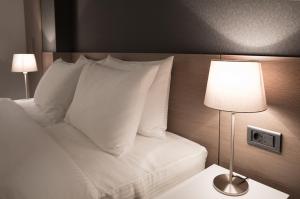 Katil atau katil-katil dalam bilik di Nova Hotel Yerevan