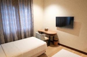 BRITS HOTEL PANGKALAN BUN客房内的一张或多张床位