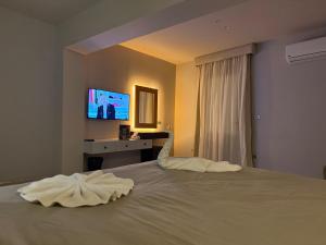 Letto o letti in una camera di NUT Pyramids Hotel