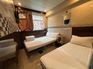3D Inn Hong Kong - Dragon客房内的一张或多张床位