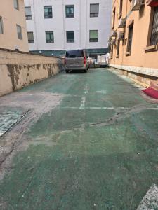 an empty parking lot with a van parked in it at Gallery motel in Incheon