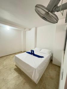 Rúm í herbergi á Hotel Dauphin Rest