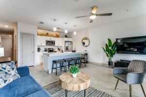 a living room with a couch and a table at Modern Cozy Condo facing Riverwalk w King Suite in San Antonio