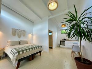Ένα ή περισσότερα κρεβάτια σε δωμάτιο στο Makihi Suites
