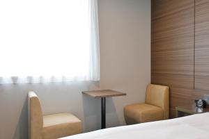 Postel nebo postele na pokoji v ubytování Via Inn Okayama